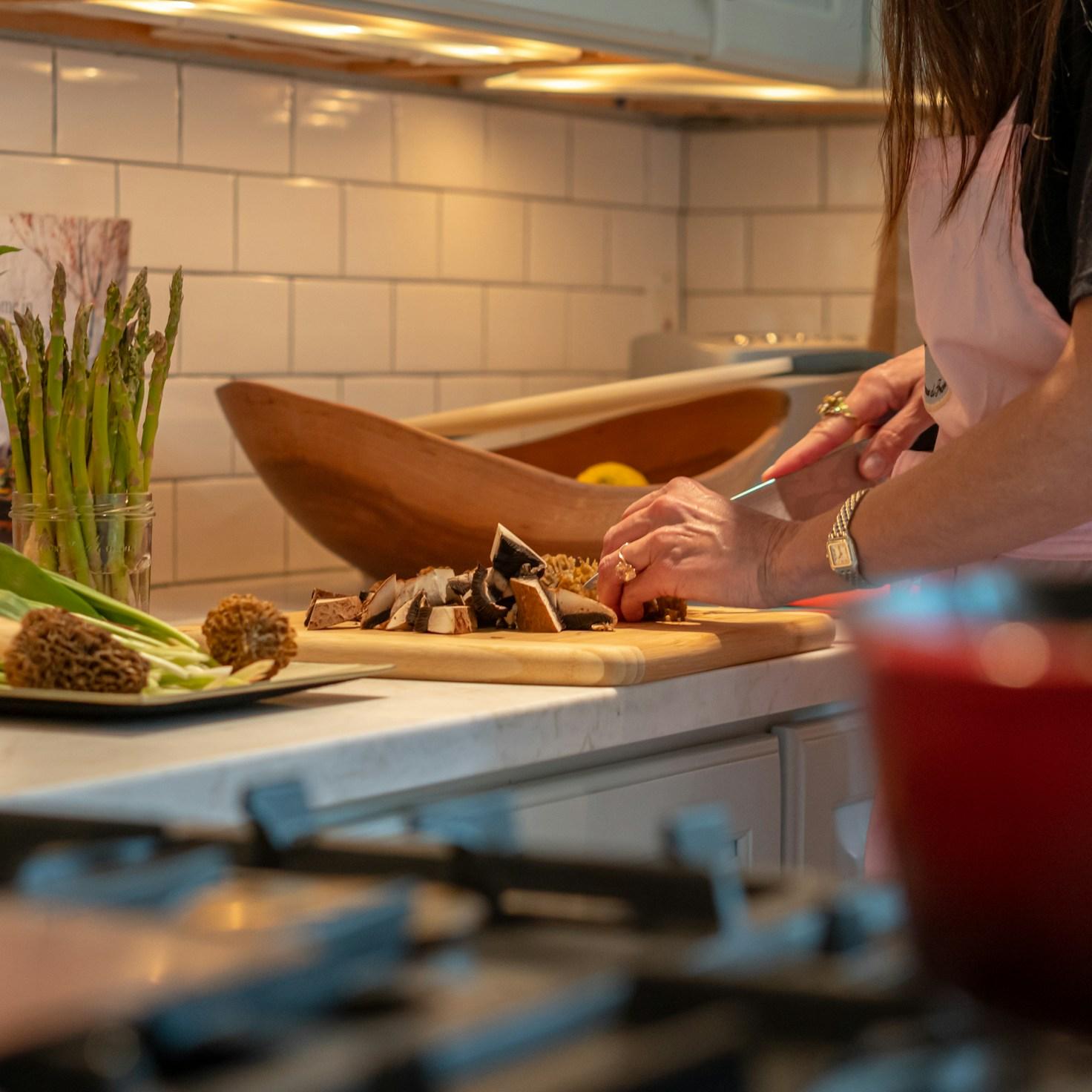 A diverse group of community members enjoying a meal together, illustrating the social bonds built through collaborative cooking